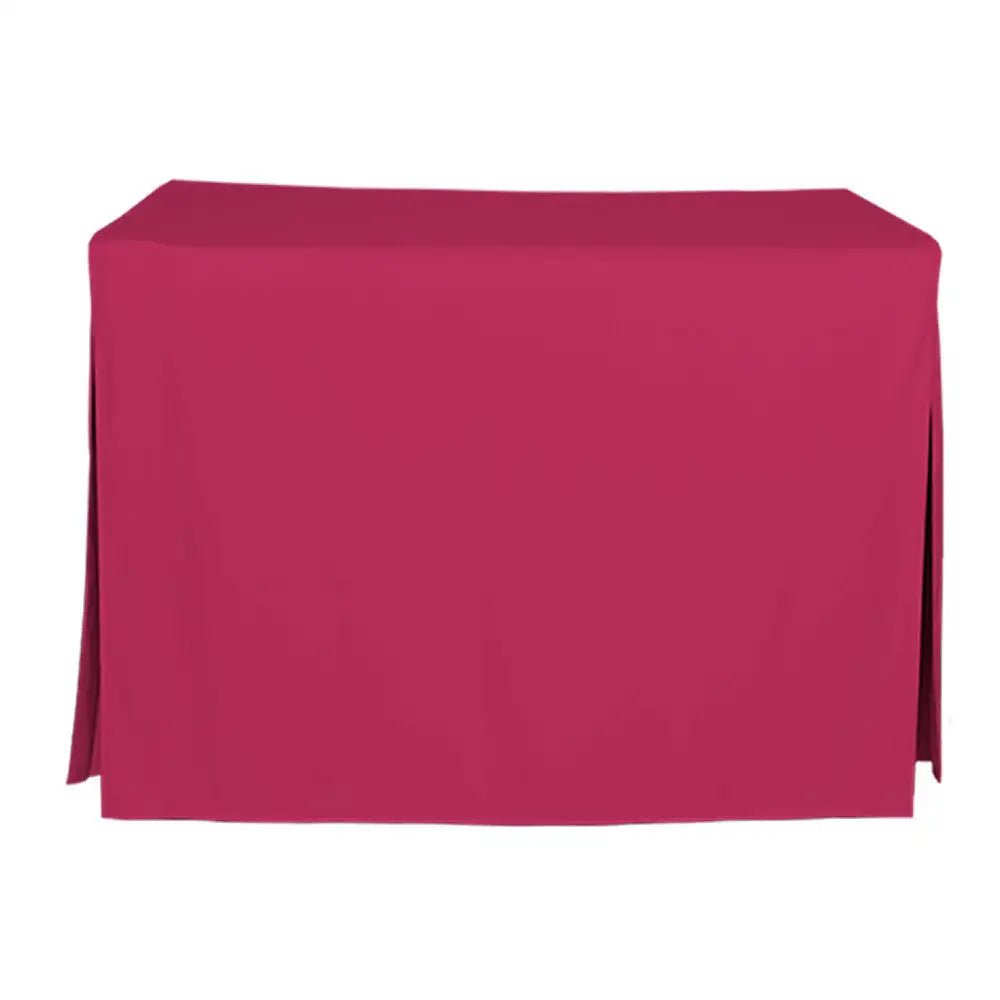A pink tablecloth draped over a rectangular table, shown against a plain white background.