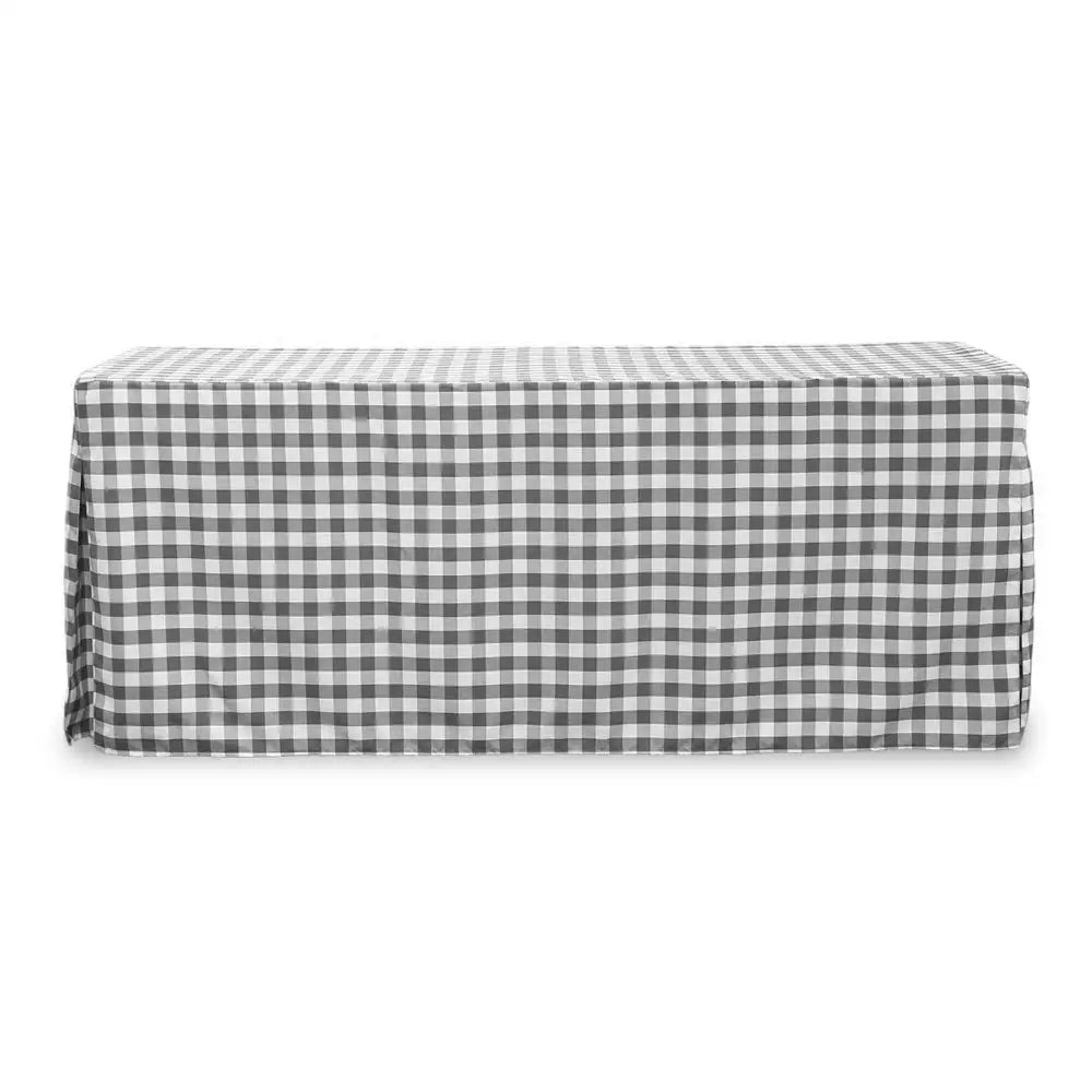 A rectangular table covered with a black and white gingham checkered tablecloth, shown against a plain white background.