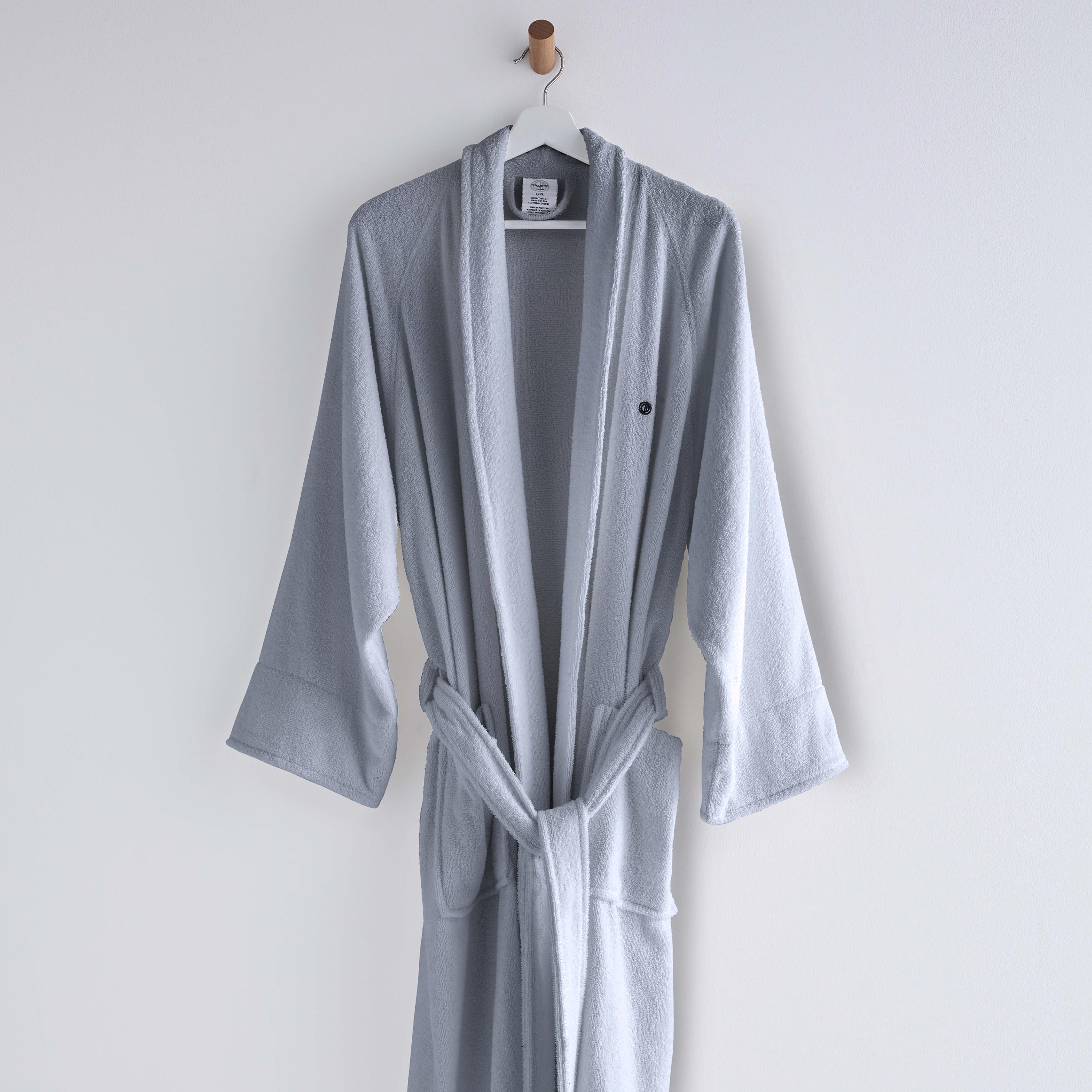 Light gray terry bath robe with long sleeves, a belt, and a hanging loop.
