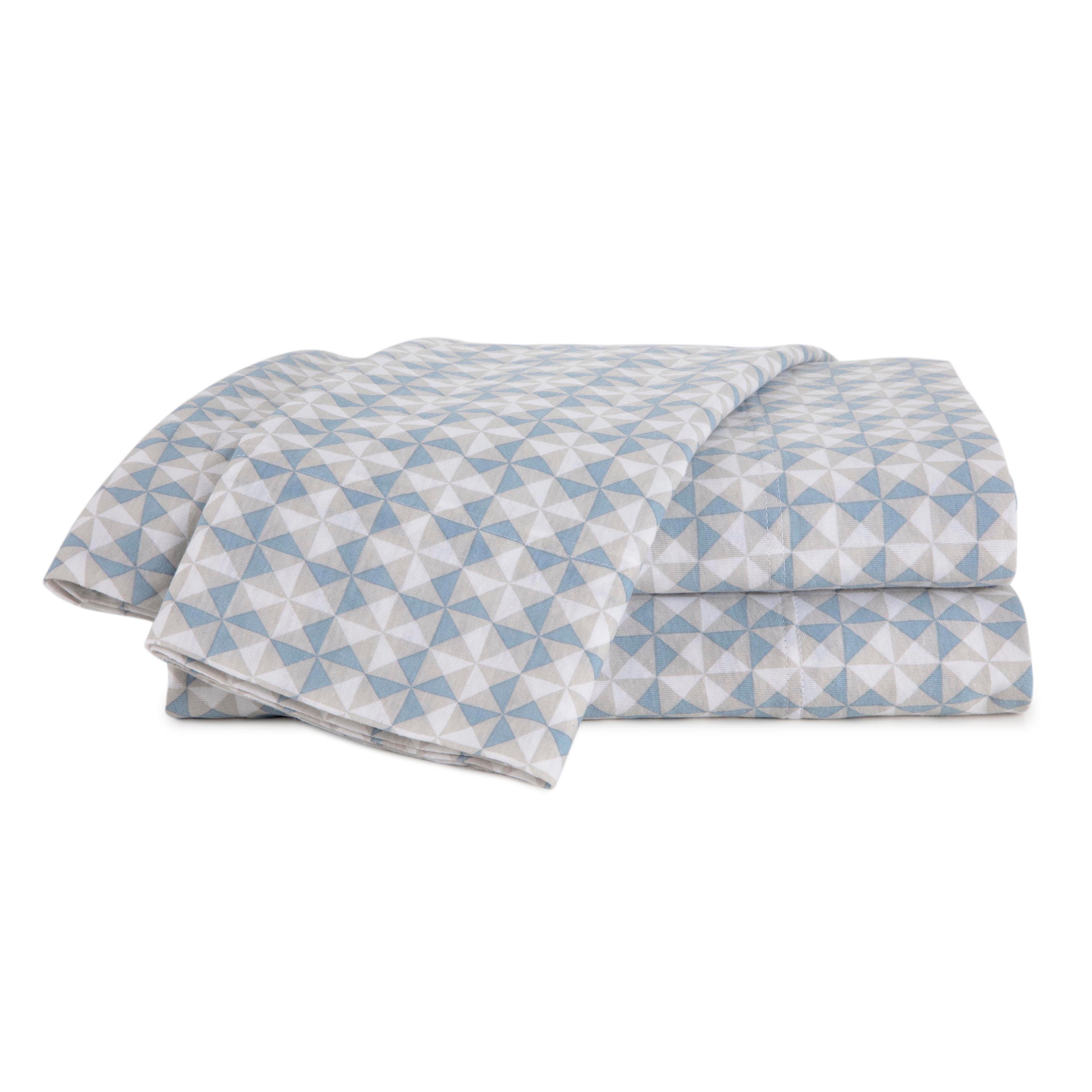 Soft blue sheet set featuring a geometric triangle pattern in light and dark shades.