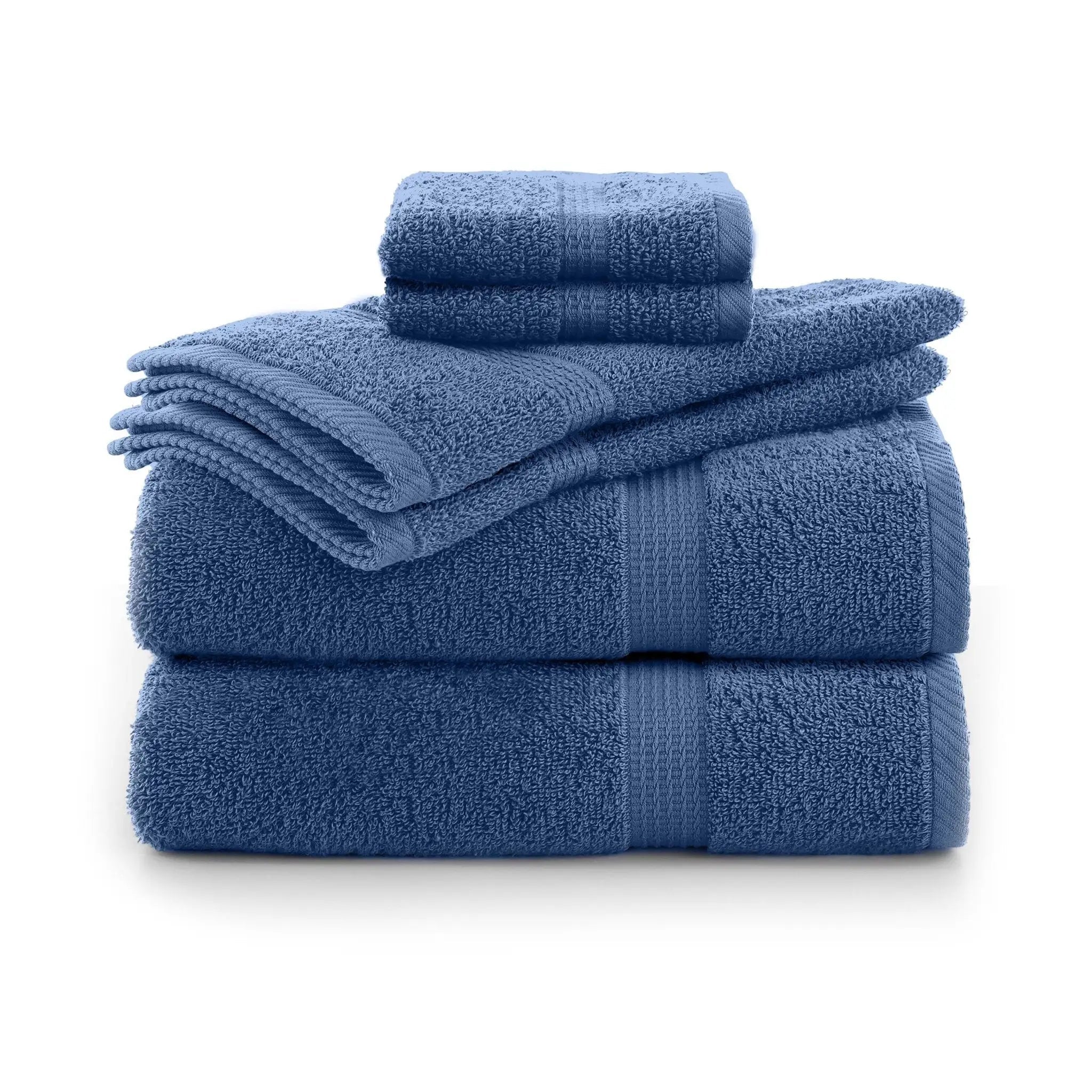 Set of blue towels stacked on a white background
