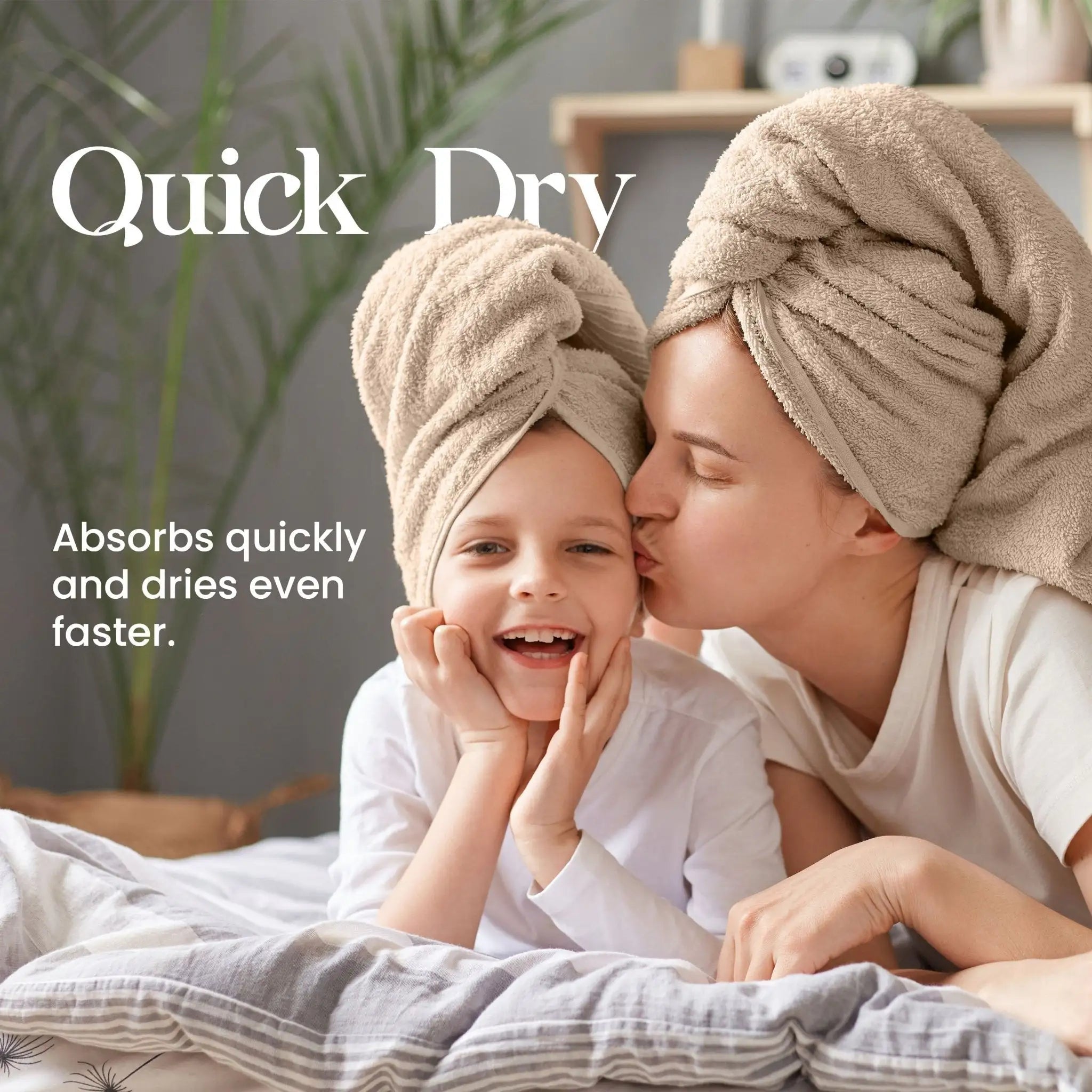 Woman and child with linen towels on heads in a bathroom setting, promoting quick-drying towels.