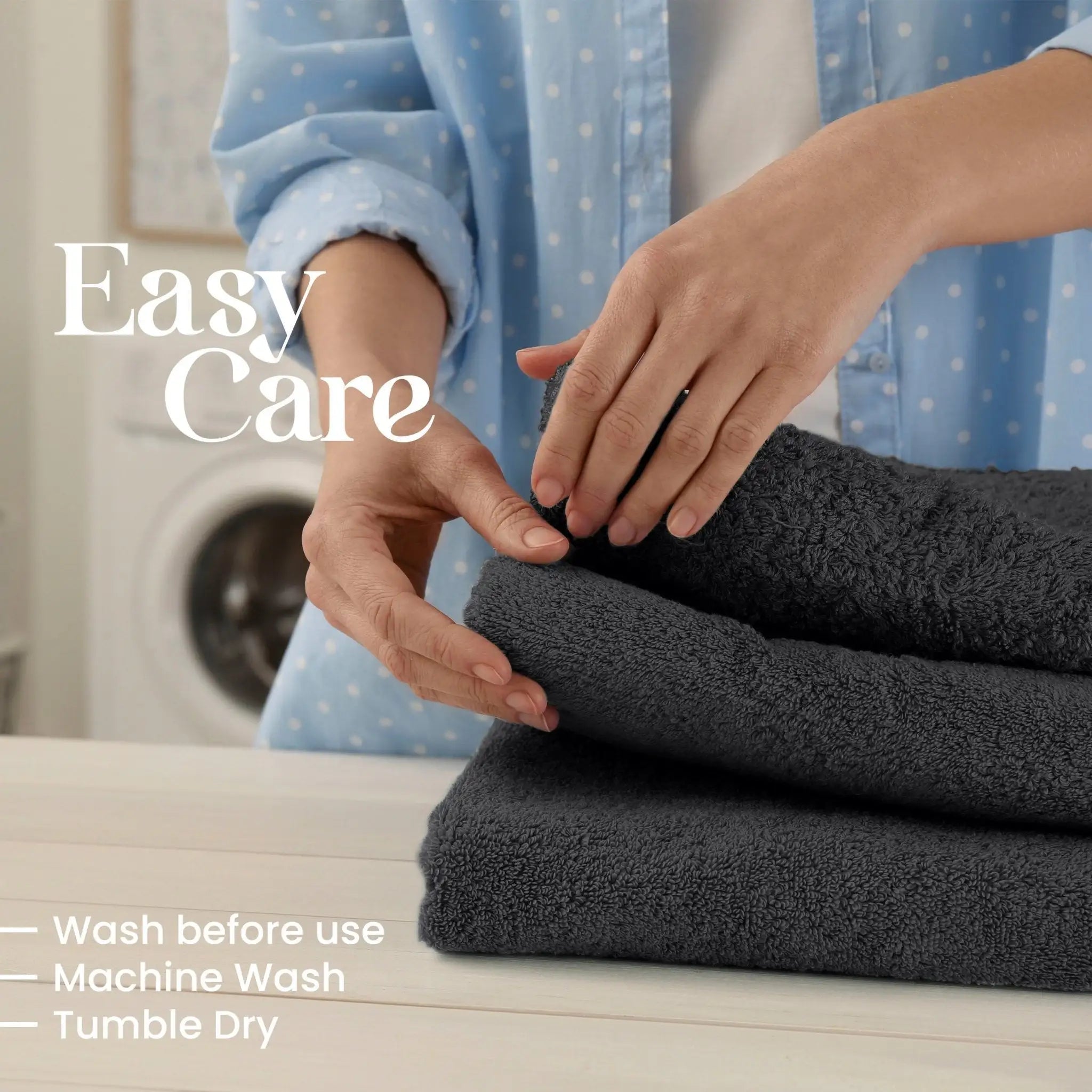 Person folding black towels with washing machine in the background, text indicating care instructions.