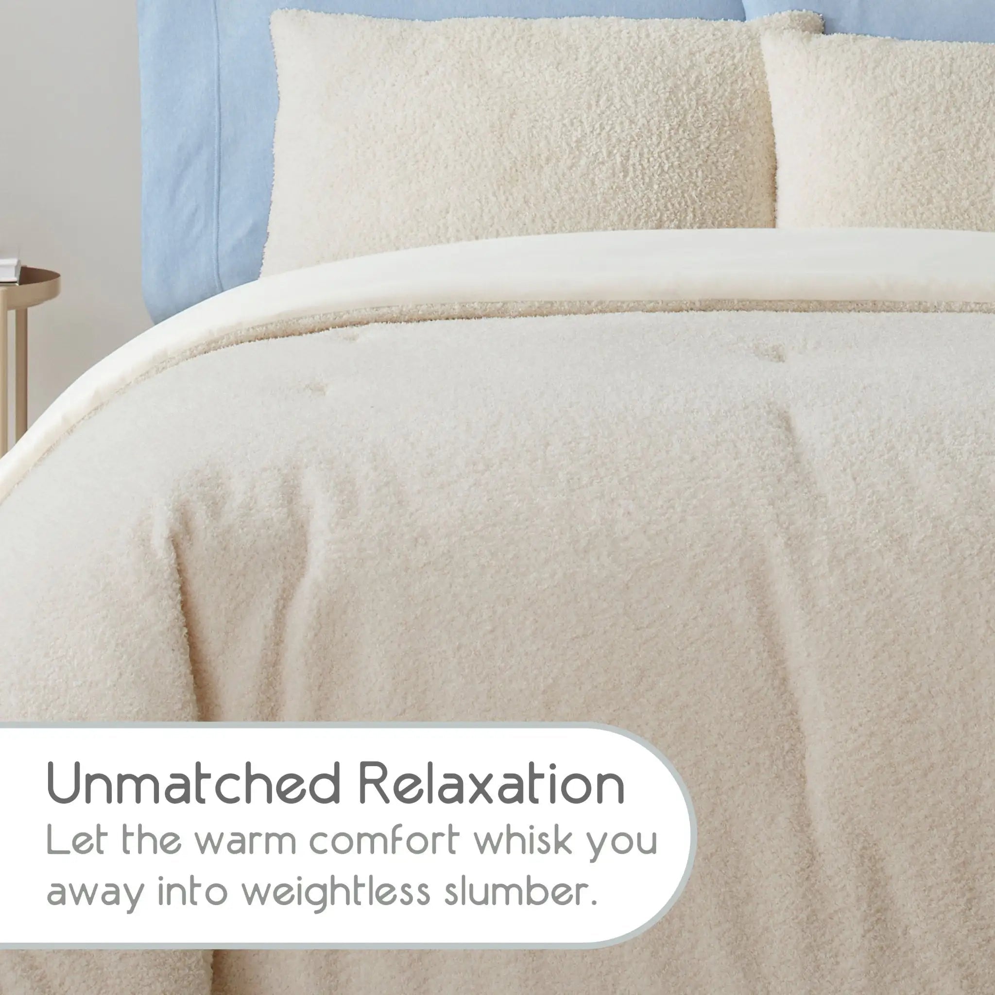 A close-up of a soft, beige-colored comforter, with matching pillow shams and a light blue headboard visible in the background. A white text overlay at the bottom reads, 'Unmatched Relaxation Let the warm comfort whisk you away into weightless slumber.