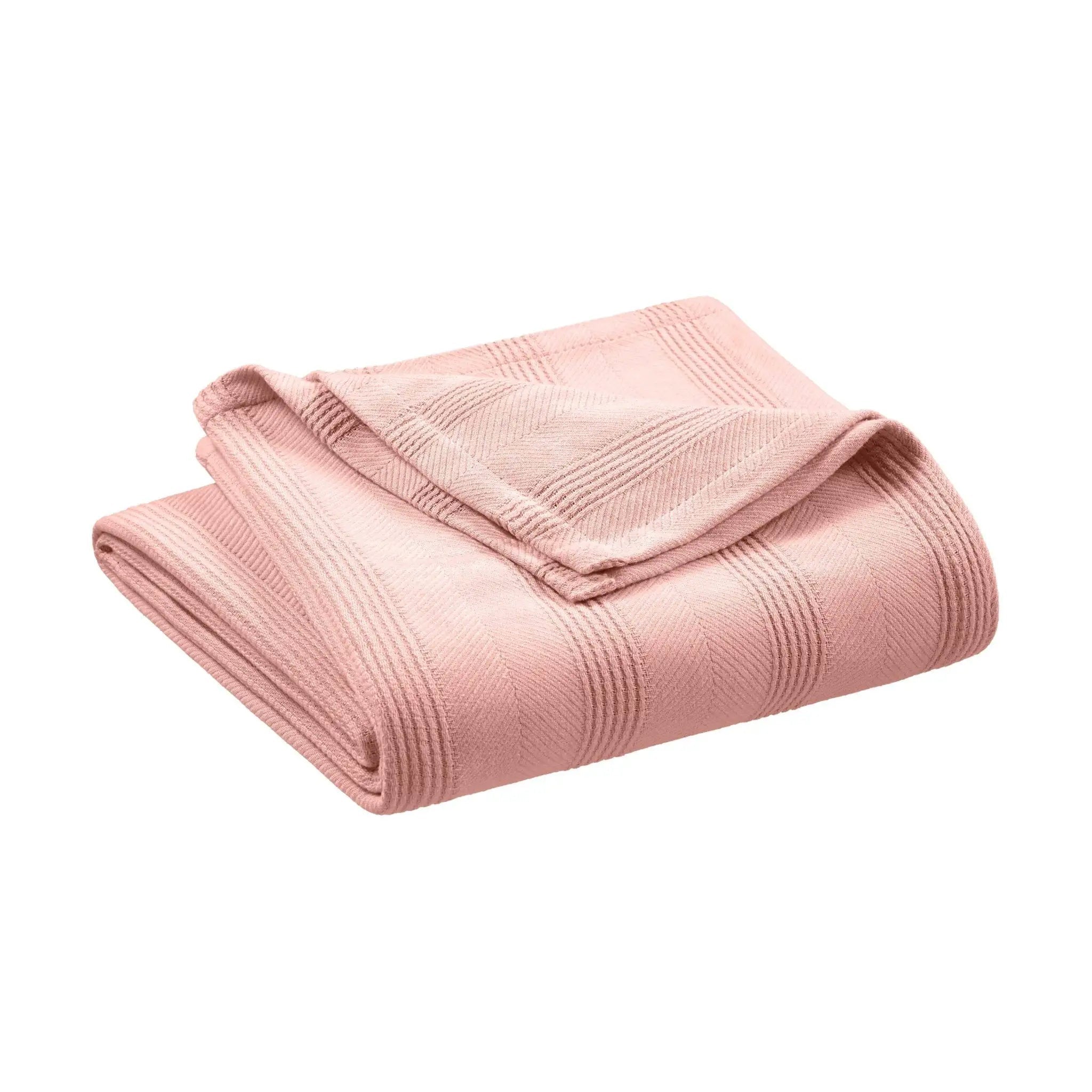 Folded pink blanket on a white background
