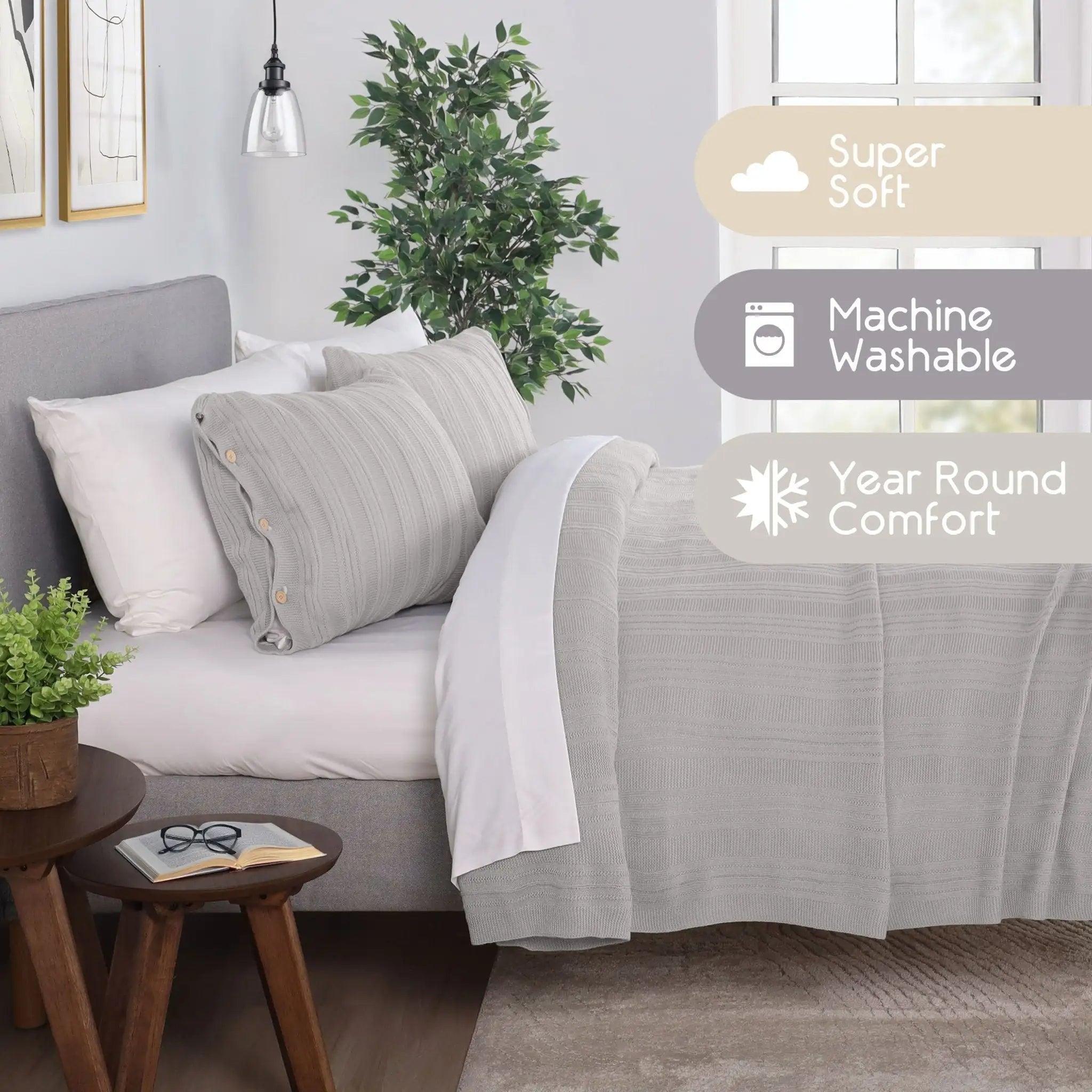 A light gray textured bedding set, including a blanket and matching pillow shams, styled on a bed in a modern bedroom. The image features three promotional badges on the right highlighting 'Super Soft', 'Machine Washable', and 'Year Round Comfort'.