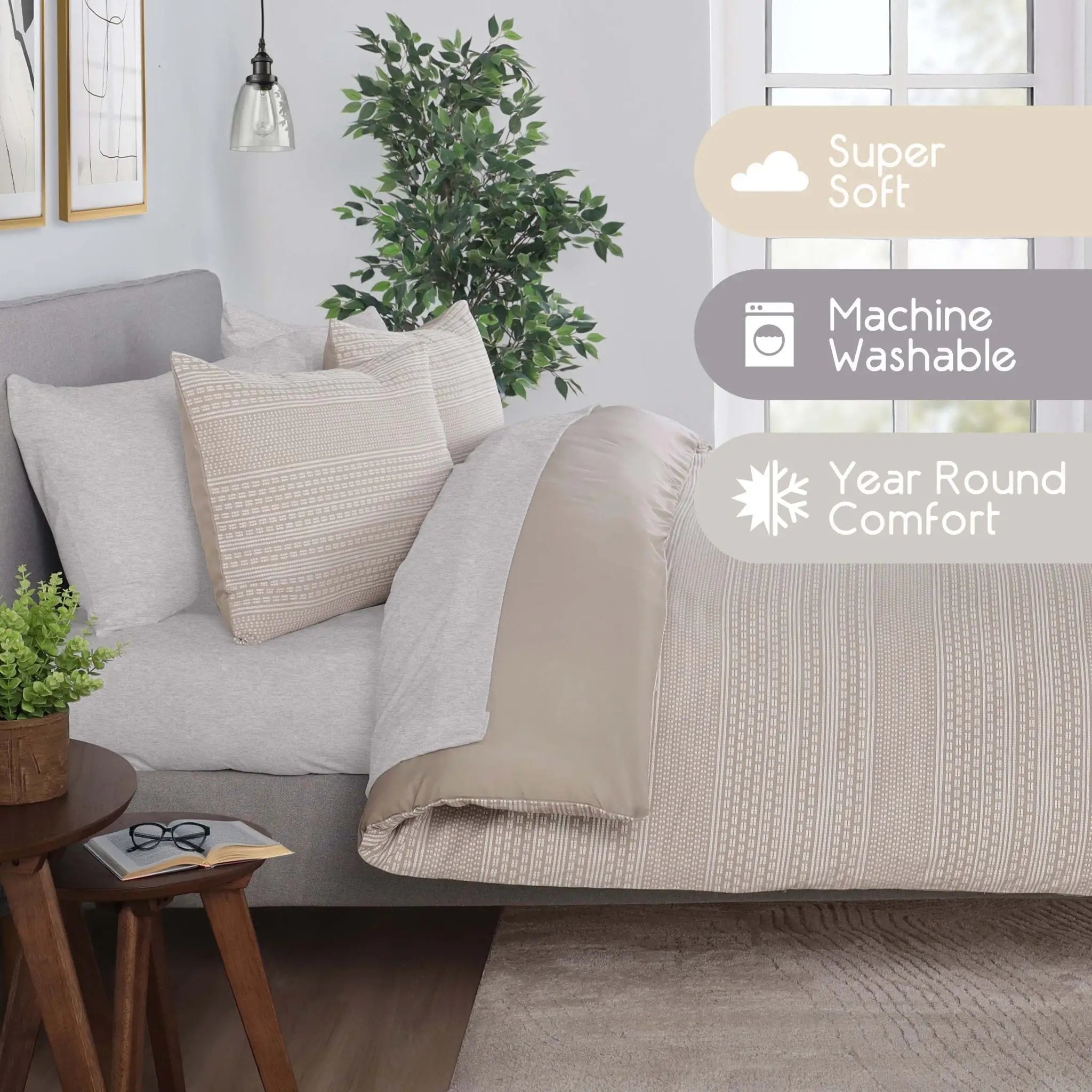 A styled bed in a bedroom setting with light beige comforter set. The scene includes three informational text overlays on the right side reading 'Super Soft', 'Machine Washable', and 'Year Round Comfort'.