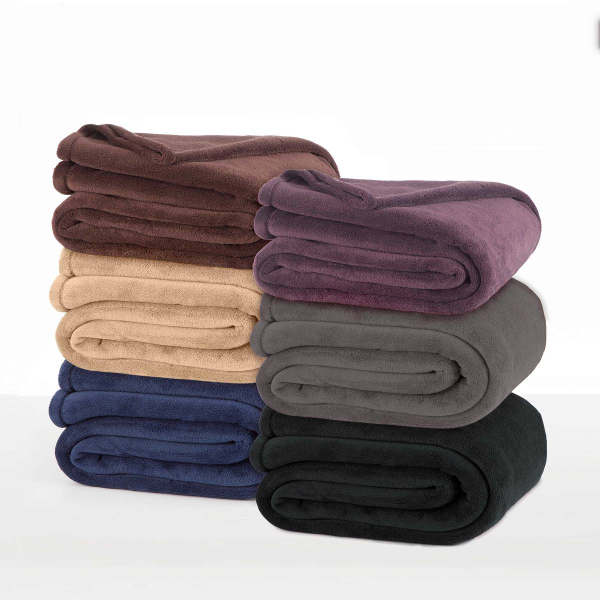 Stack of plush blankets in various colors: brown, beige, purple, gray, navy, and black.