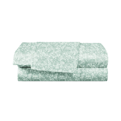 Light green sheet set with a textured, abstract pattern, neatly folded.