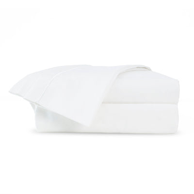 White Supima cotton sheet set folded neatly, featuring a smooth texture and a 700-thread count.