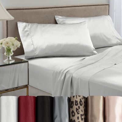 White satin sheet set on a bed with two matching pillows, alongside various color options displayed below.