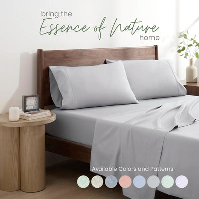 Gray bedding set on a bed with color swatches.