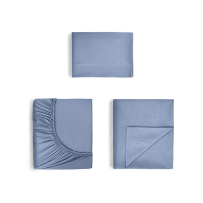 Set of blue cotton sheets including a fitted sheet, flat sheet, and pillowcase.