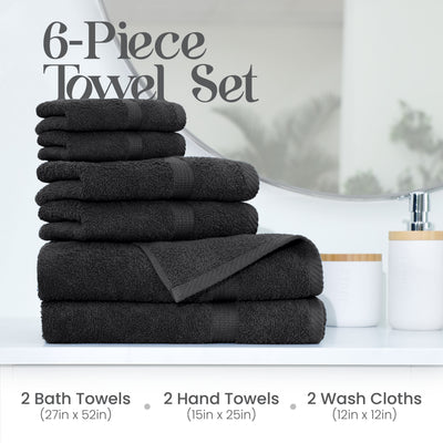 Six stacked black towels, including two bath towels, two hand towels, and two wash cloths, displayed on a white surface.
