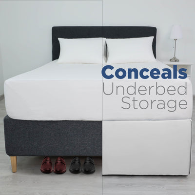 Bed with a white mattress and two pillows, featuring a long bed skirt that covers underbed storage and shoes.