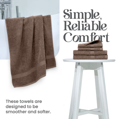 Brown towels hanging over a bathtub and stacked on a white stool, showcasing a soft texture.