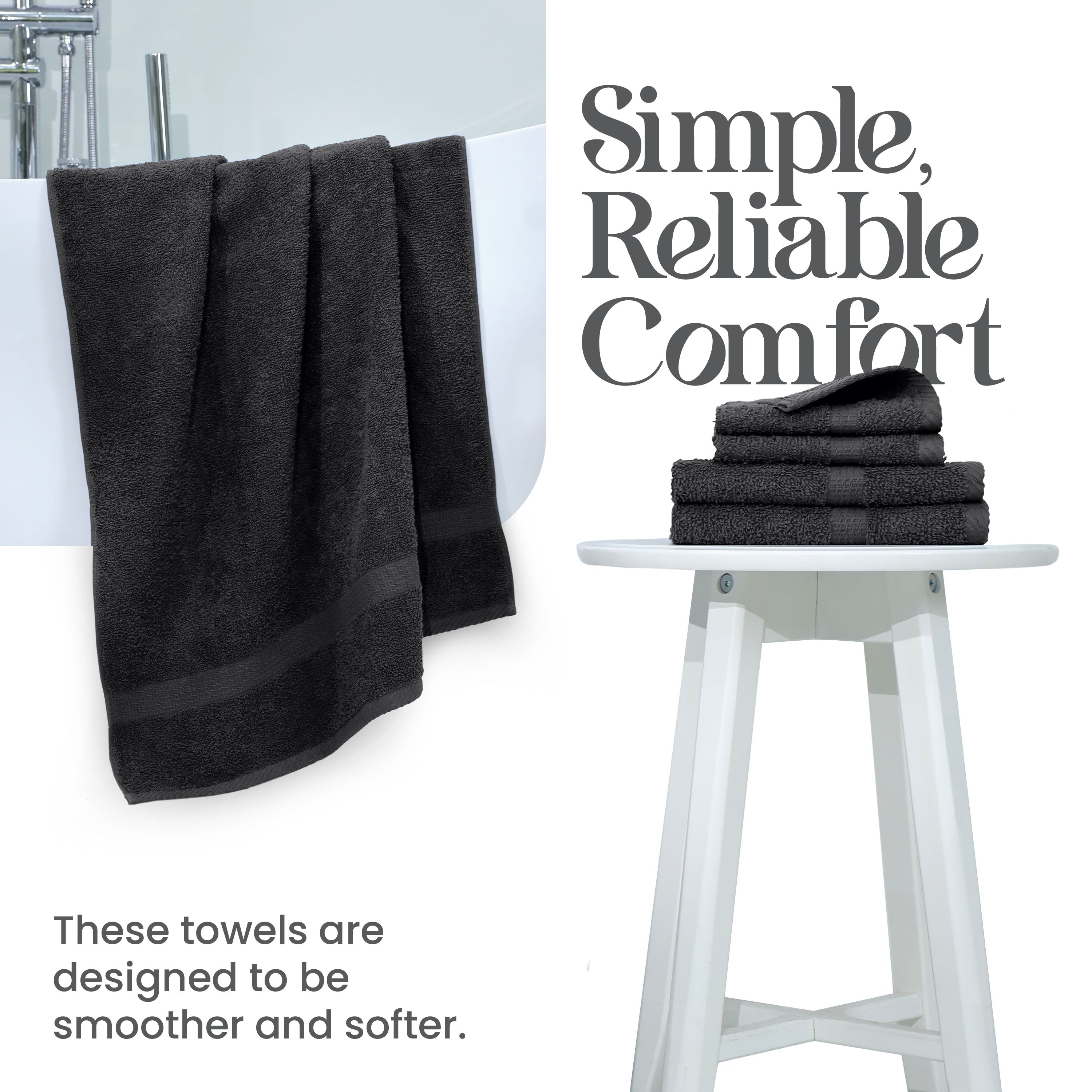 Black towels hanging over a white tub, with a stack of folded towels on a white stool beside them.