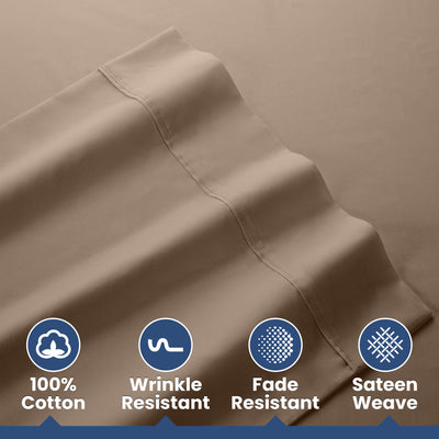 Light brown cotton sheets with a smooth texture and visible stitching, labeled with care features.