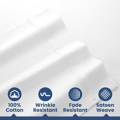 White cotton sheets with a smooth texture and features for wrinkle and fade resistance.