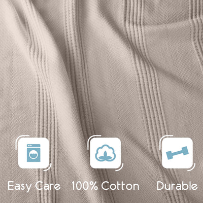 Light beige cotton blanket with a textured pattern and icons indicating easy care, 100% cotton, and durability.