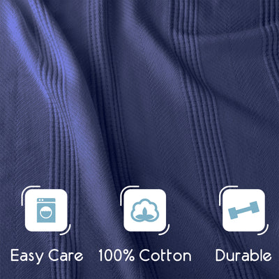 Cotton blanket with a textured pattern in dark blue, featuring icons for easy care, cotton material, and durability.