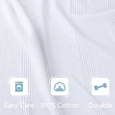 White cotton blanket with a textured pattern and icons indicating easy care, 100% cotton, and durability.
