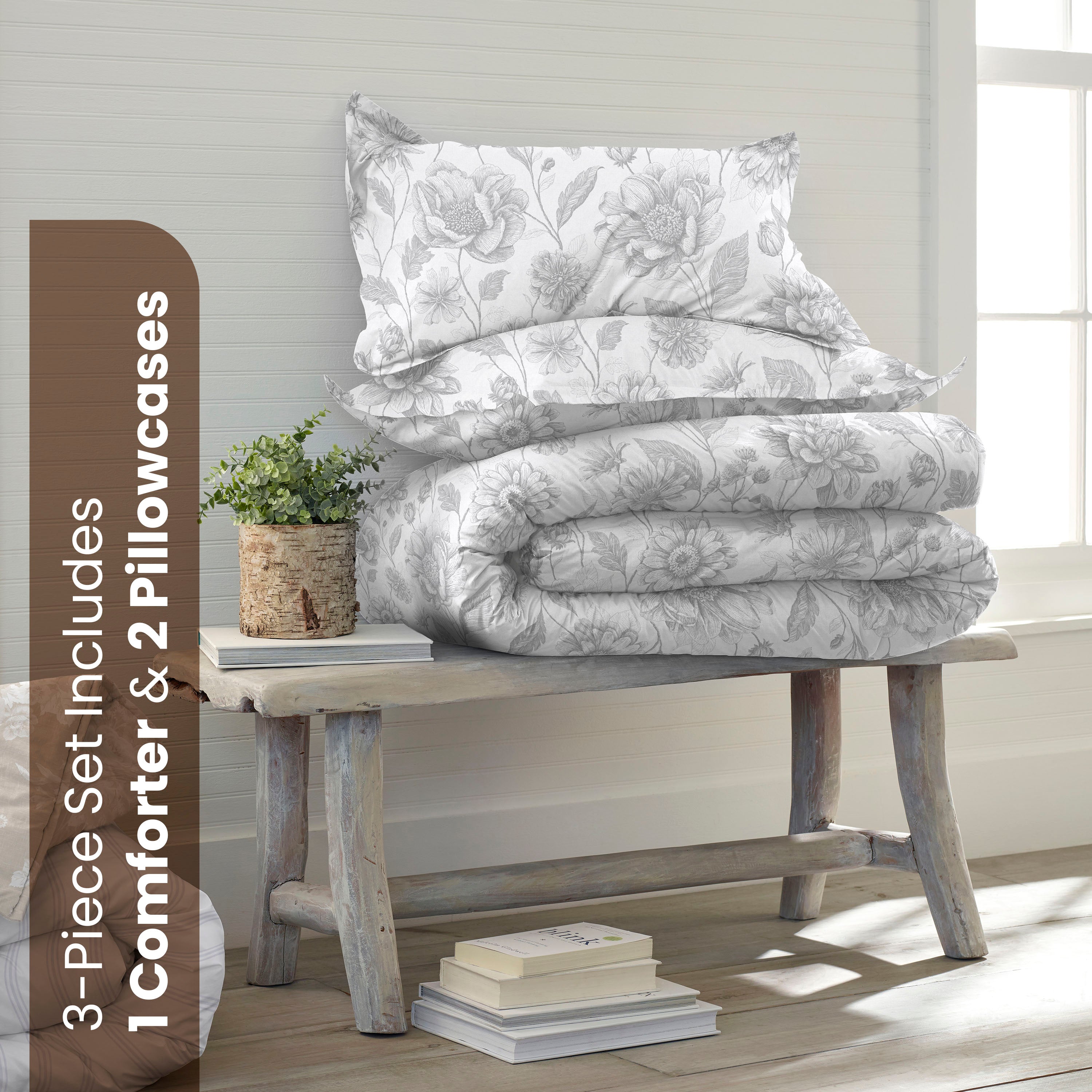 Floral-patterned comforter set on a wooden bench with the text of full/queen product components.