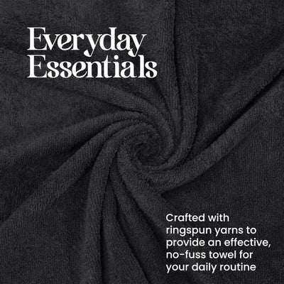 Dark gray towel with a soft, textured surface, arranged in a spiral pattern.