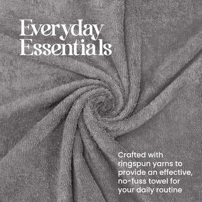 Gray towel with a textured surface, arranged in a spiral pattern.