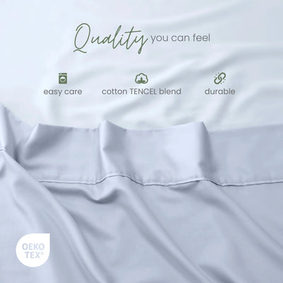 Blue fabric with white text overlays reading 'Quality you can feel', 'easy care', 'cotton TENCEL blend', and 'durable', plus an OEKO-TEX certification badge.