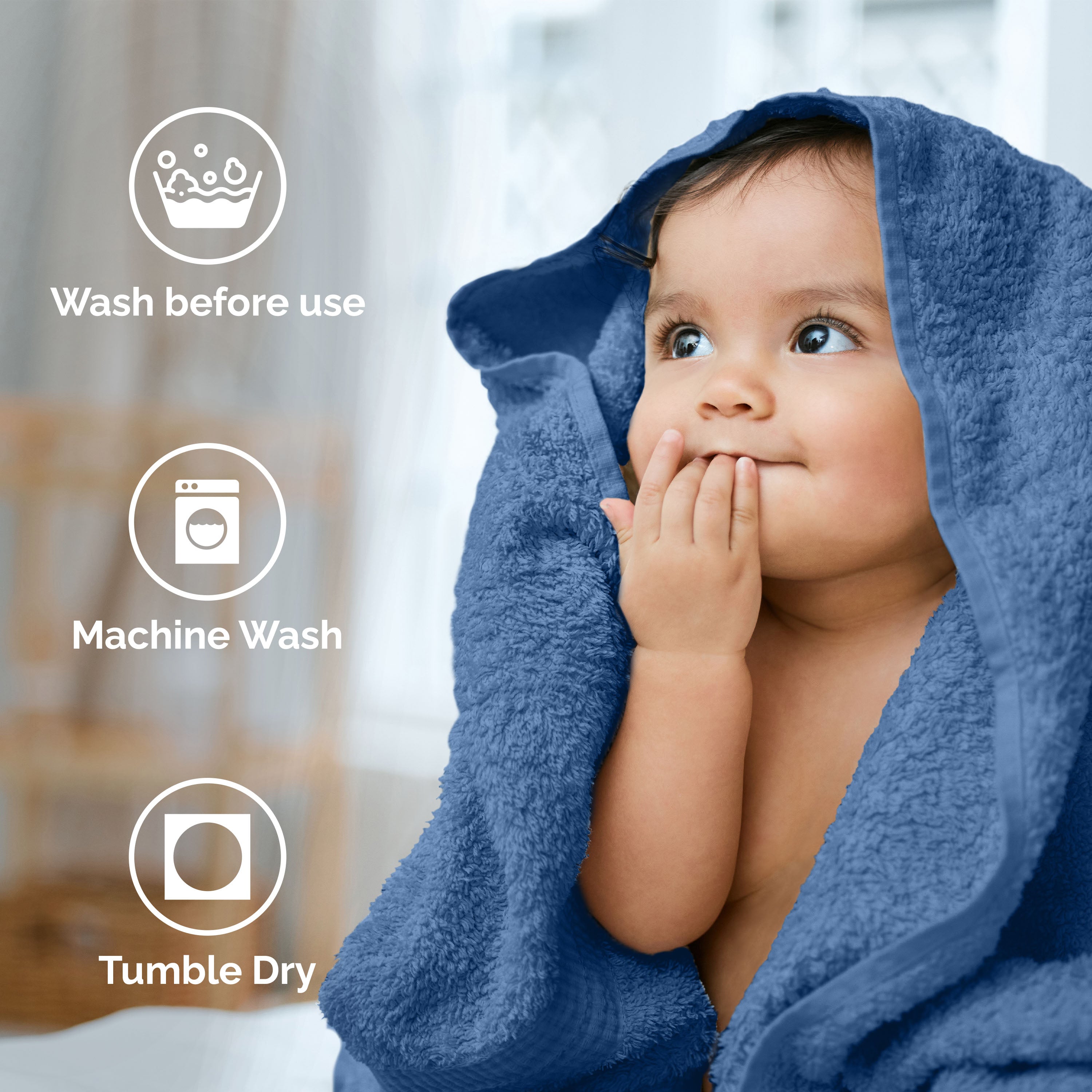 Child wrapped in a blue towel, with icons indicating care instructions: wash before use, machine wash, tumble dry.