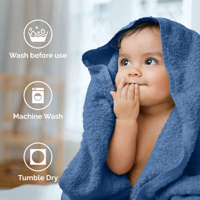 Child wrapped in a blue towel, with icons indicating care instructions: wash before use, machine wash, tumble dry.