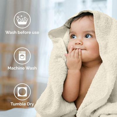 Child wrapped in a light-colored towel, with care instructions displayed beside them.