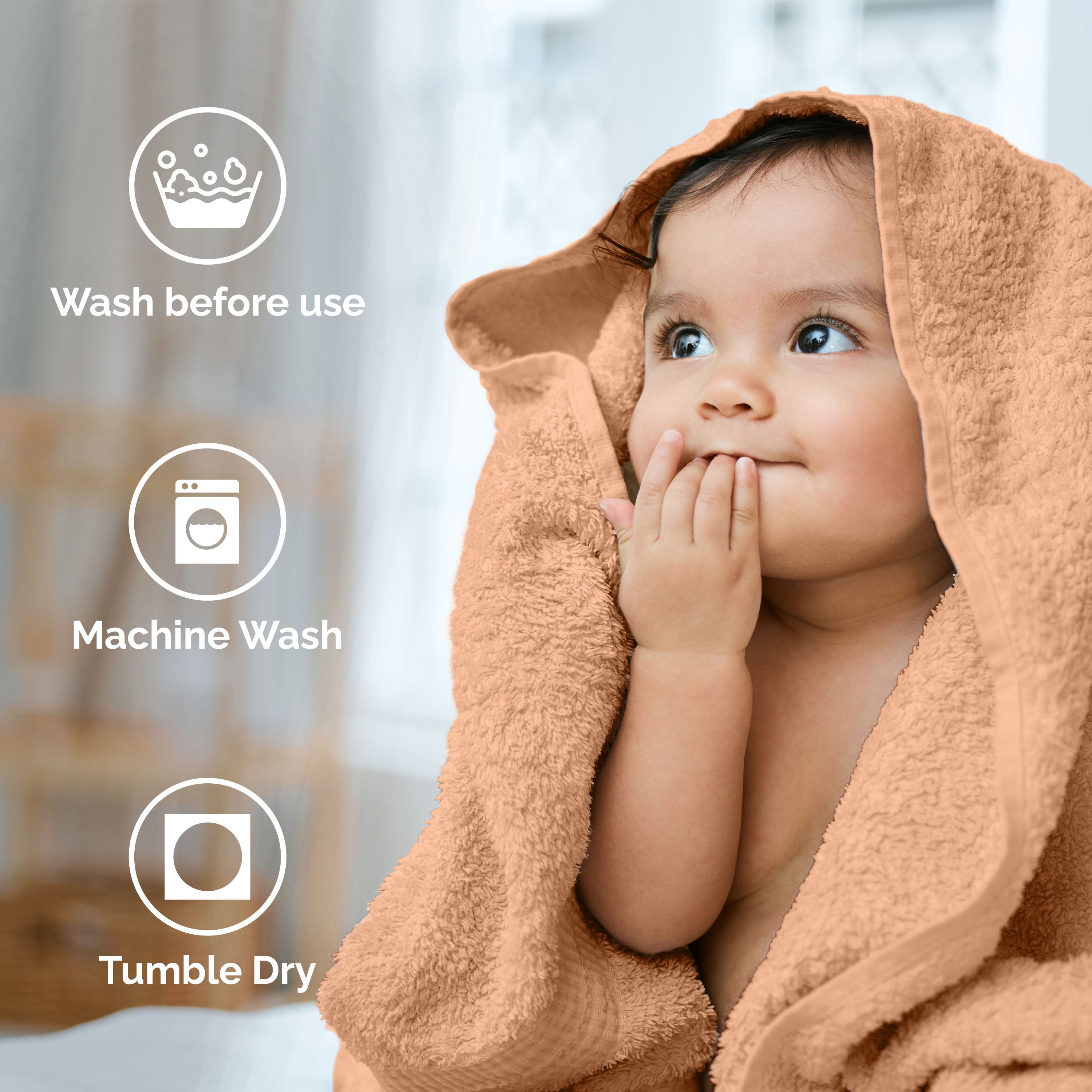 Child wrapped in a soft, orange towel with icons indicating washing instructions in the background.