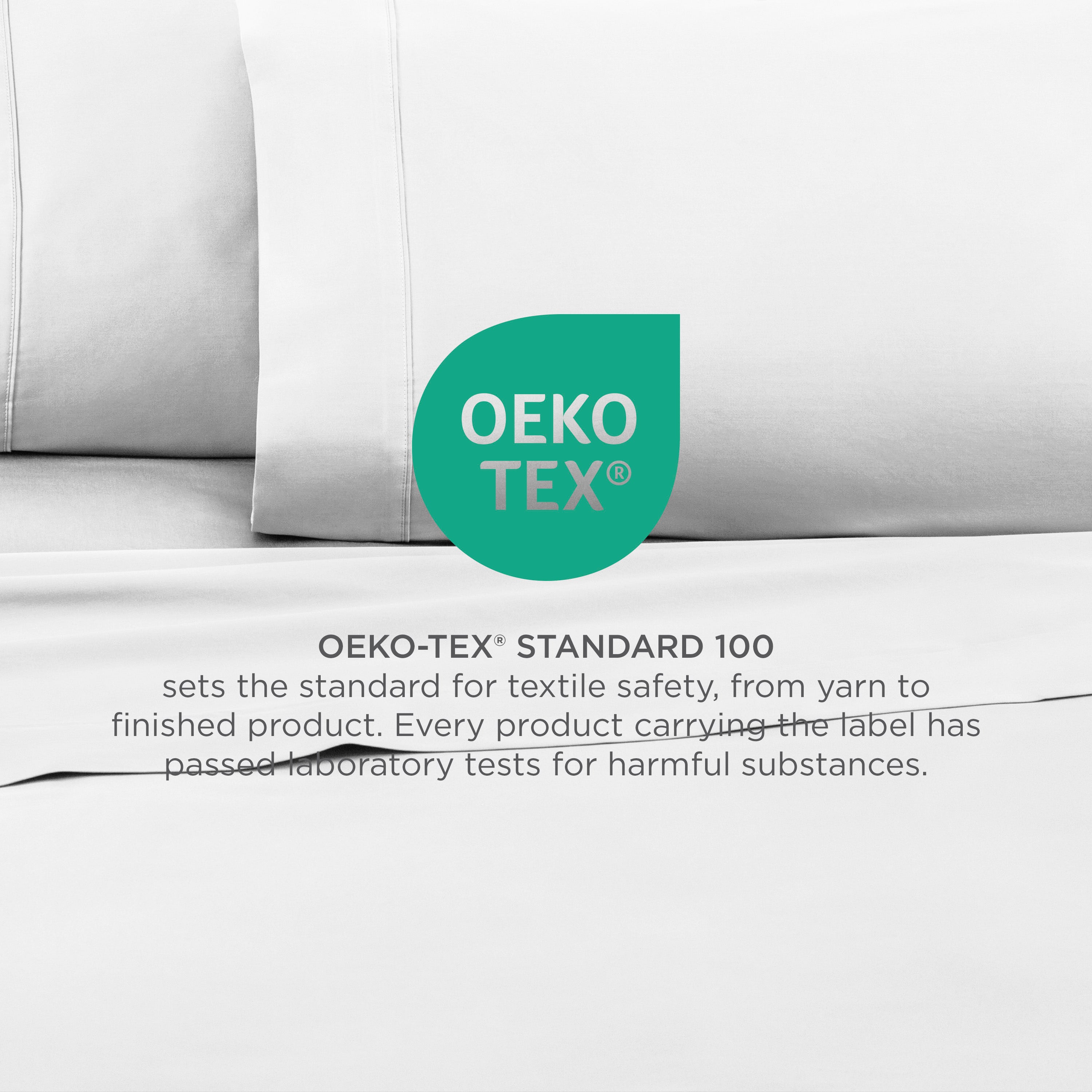 White cotton sheets with an Oeko-Tex Standard 100 certification label indicating textile safety.