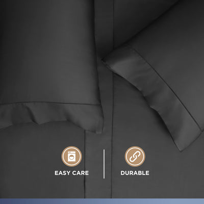 Dark gray sheets and pillowcases with a smooth texture and care icons for easy maintenance and durability.