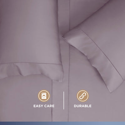 Light purple sheet set with two pillows, featuring a smooth texture and subtle stitching details.
