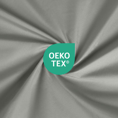 Close-up of gray fabric with an Oeko-Tex certification logo in green.