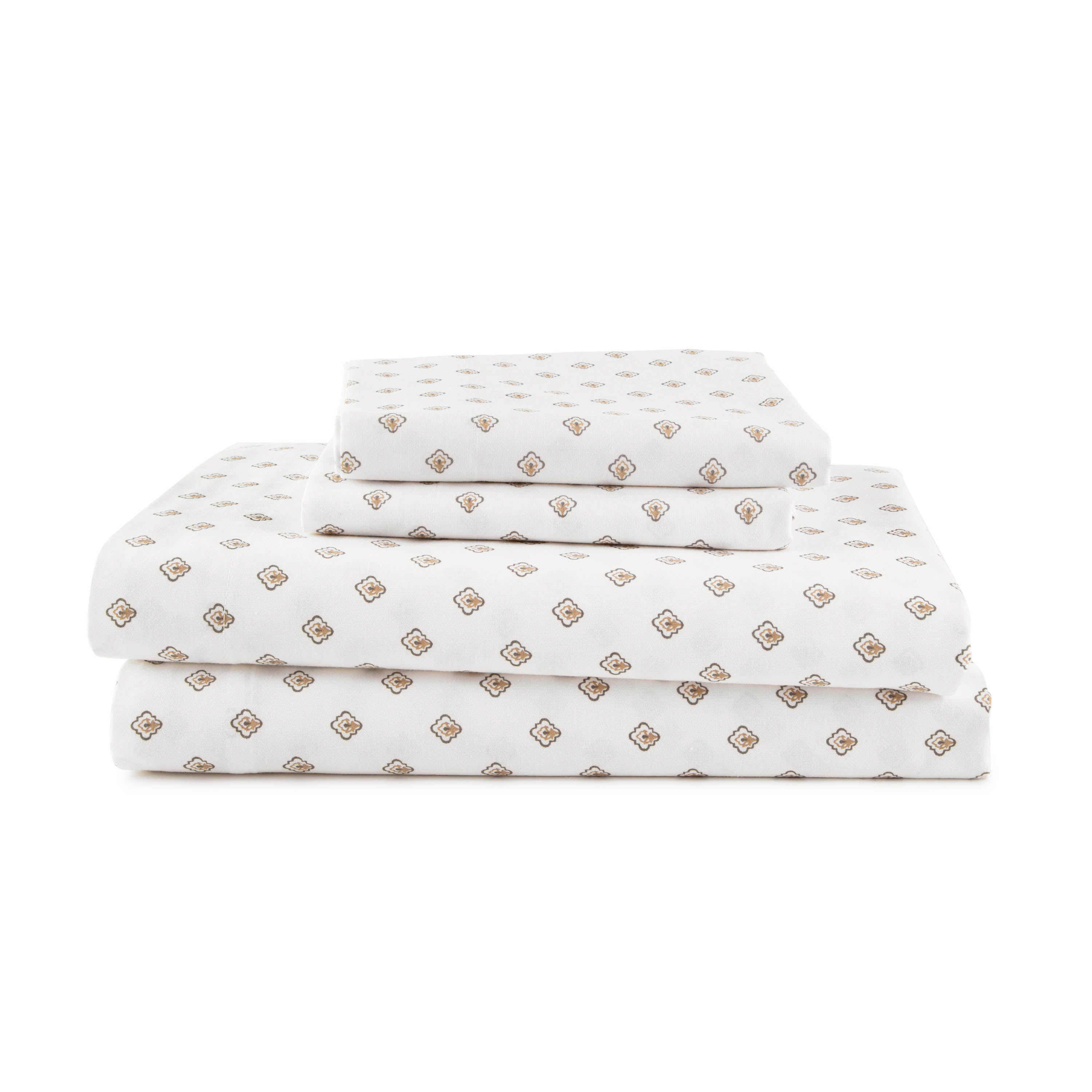 Sheet set featuring a white background with a repeating geometric pattern in brown and gold tones.