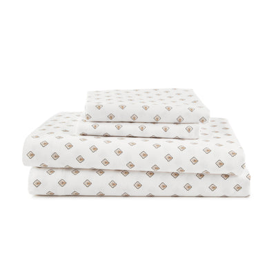 Sheet set featuring a white background with a repeating geometric pattern in brown and gold tones.