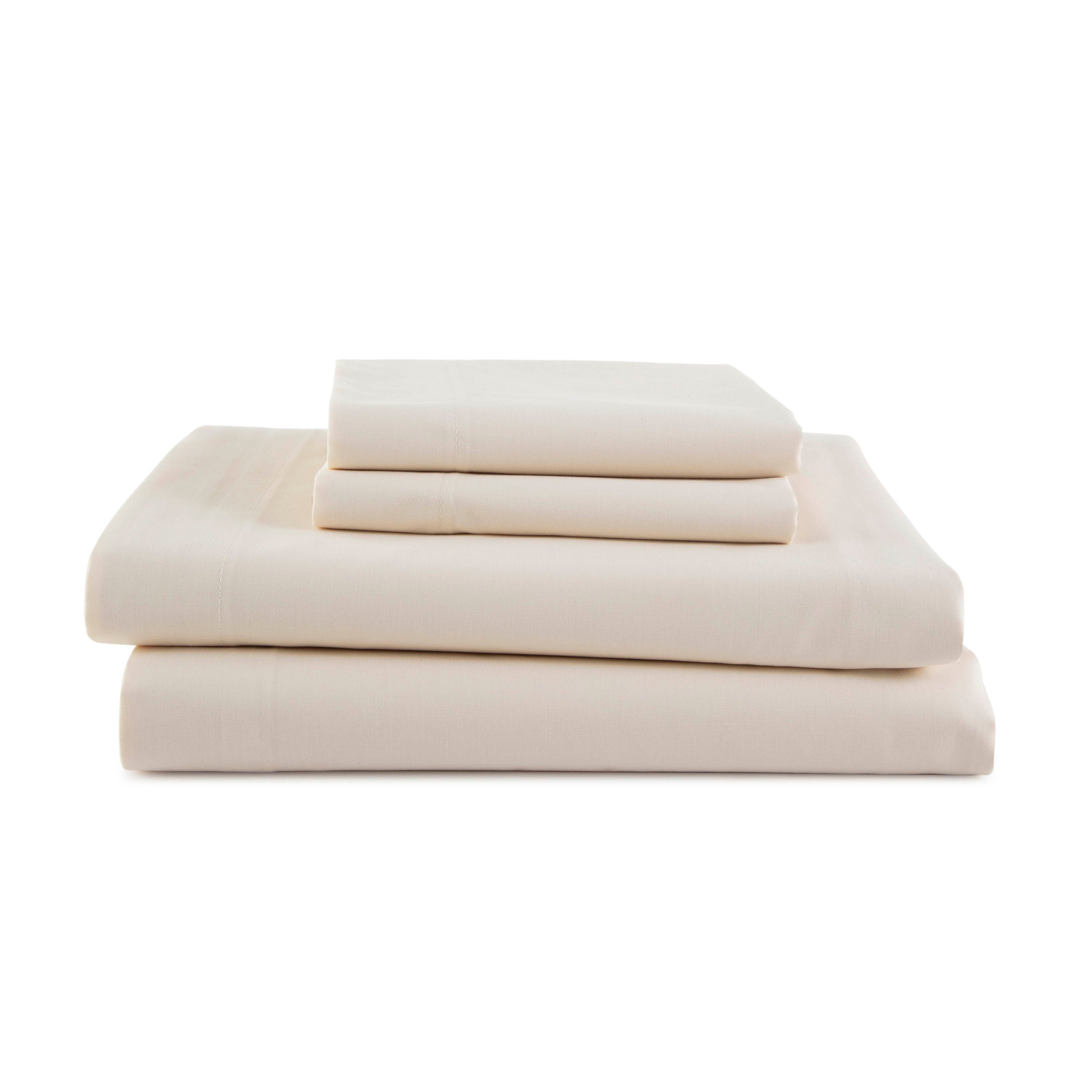 Four pieces of cream-colored sheets stacked neatly, featuring a smooth texture and subtle detailing.