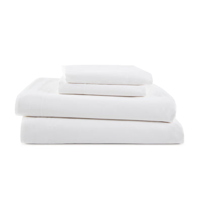 Four white sheets stacked neatly, including a fitted sheet, flat sheet, and two pillowcases.