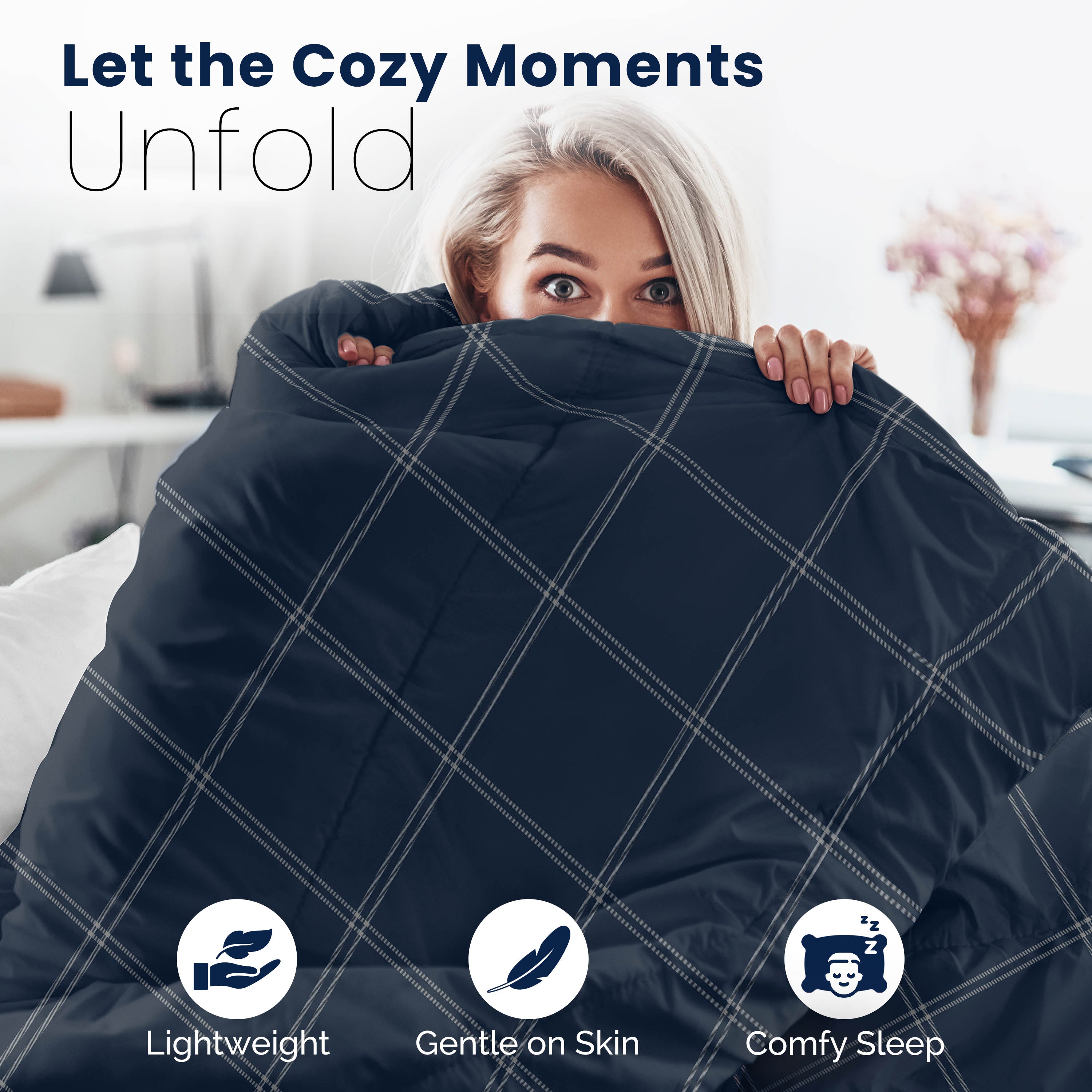 Reversible comforter set featuring a navy blue color with a plaid pattern, shown draped over a person.