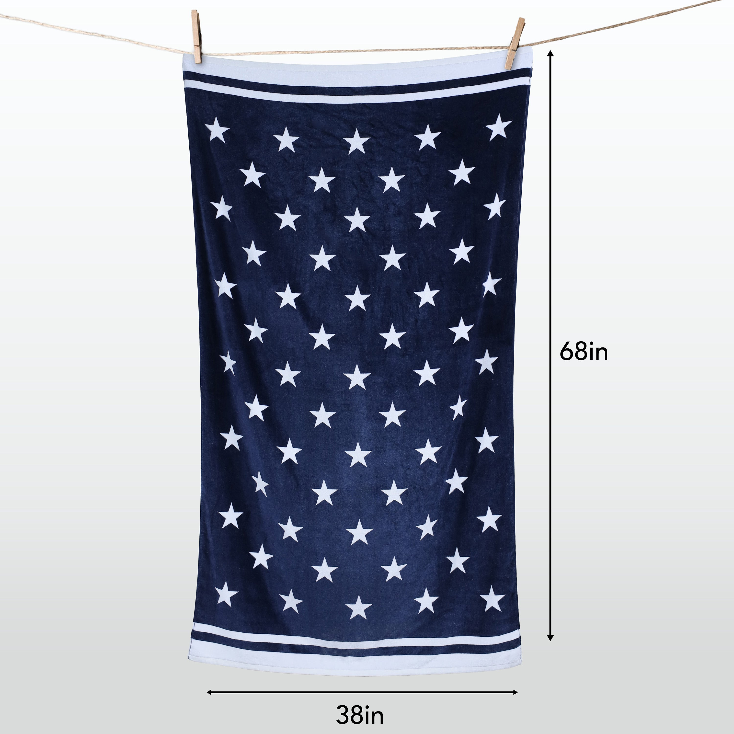 Navy blue towel with white star pattern hanging on a line, with measurements indicated.