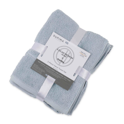 Two soft, light blue hand towels stacked and secured with a white ribbon and label.