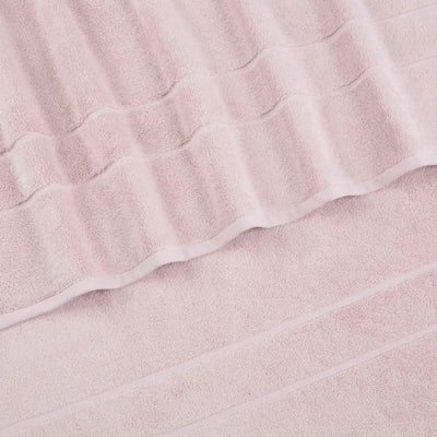 Two soft pink hand towels with textured stripes and a smooth border.