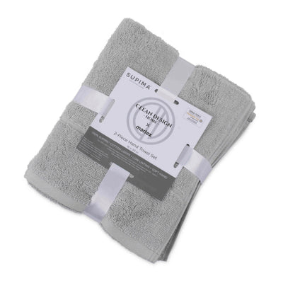 Two gray hand towels neatly stacked and secured with a label detailing product information.
