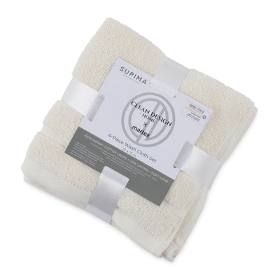 Four white wash cloths neatly stacked and wrapped with a label, measuring 13 x 13 inches each.