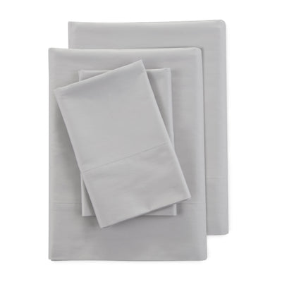 Four-piece sheet set in light gray, featuring a flat sheet, fitted sheet, and two pillowcases.