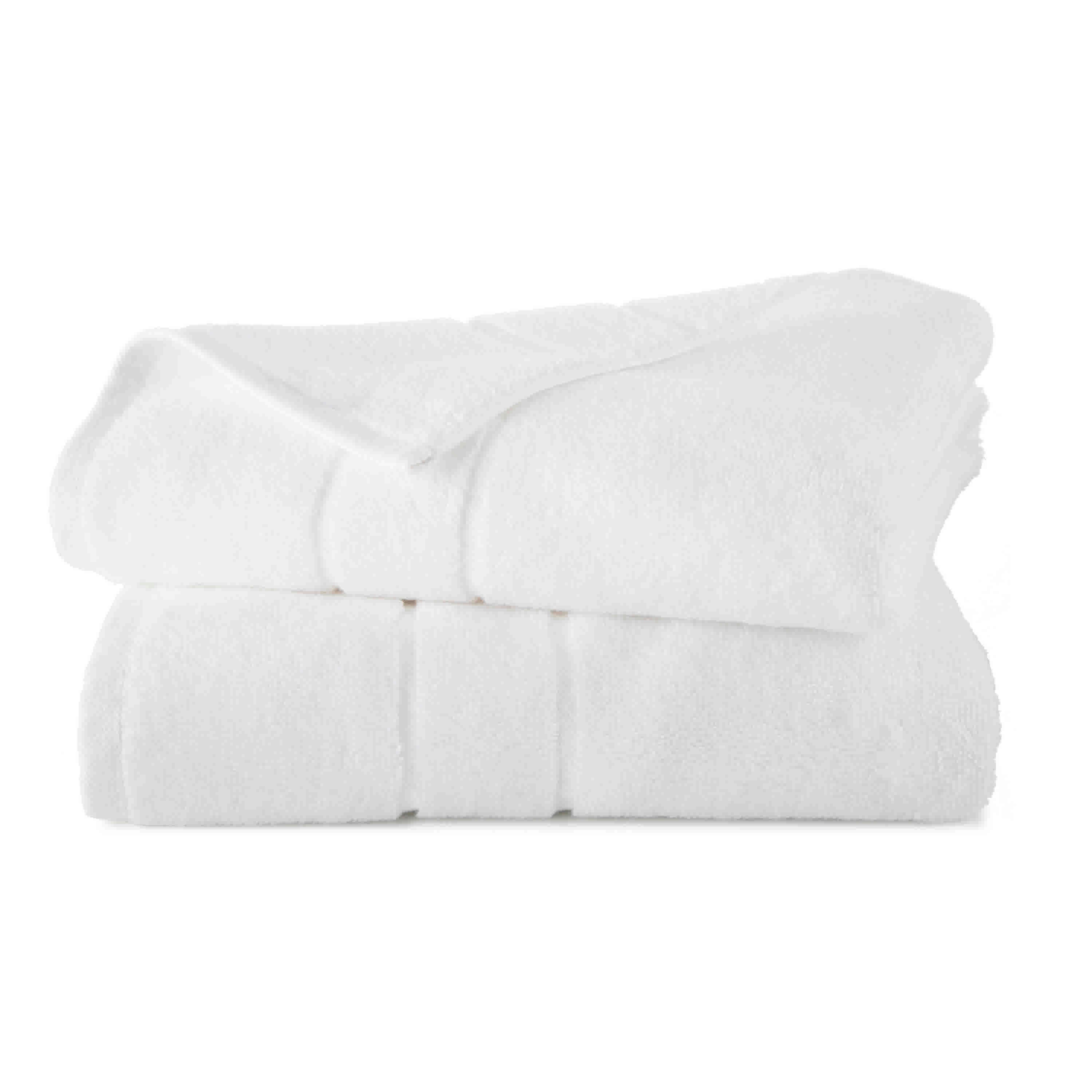 Two stacked white bath towels with a soft texture and subtle ribbed detailing.